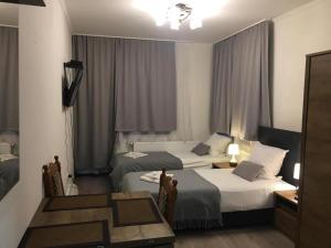 Postel nebo postele na pokoji v ubytování Aranykorona Hotel + 37 fotografií
