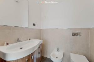 a bathroom with a sink and a toilet at New Murlo, Terre Marine in La Spezia +6 photos