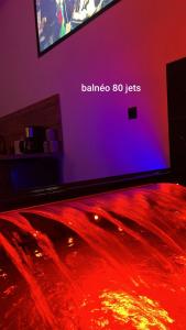 a flat screen tv sitting on top of a table at Chez sousouzen in Dunkerque +1 photo