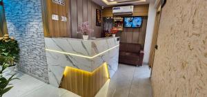 TV a/nebo společenská místnost v ubytování Hotel Lee Grand