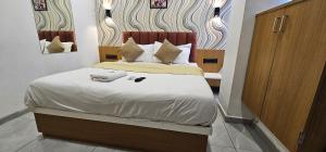 Postel nebo postele na pokoji v ubytování Hotel Lee Grand