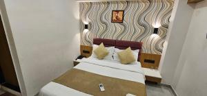 Postel nebo postele na pokoji v ubytování Hotel Lee Grand