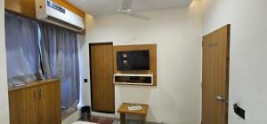 TV a/nebo společenská místnost v ubytování Hotel Lee Grand