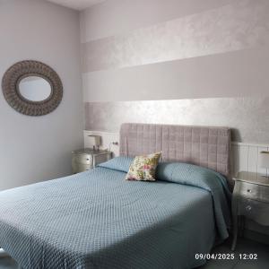 Postel nebo postele na pokoji v ubytování Casapatrizia B&B Sirmione