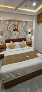 Postel nebo postele na pokoji v ubytování Hotel Lee Grand