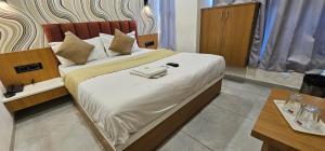 Postel nebo postele na pokoji v ubytování Hotel Lee Grand