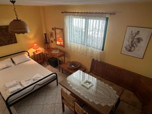 Ένα ή περισσότερα κρεβάτια σε δωμάτιο στο Villa Amorosa