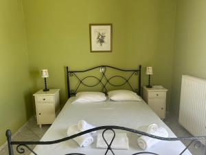 Ένα ή περισσότερα κρεβάτια σε δωμάτιο στο Villa Amorosa