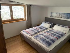 Postel nebo postele na pokoji v ubytování Geelink's Berghütte