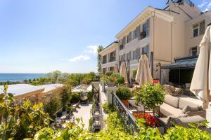an outdoor patio with umbrellas and a building at Mula Hotel in Istanbul