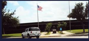 a white van parked in a parking lot with an american flag at Executive inn in Crystal City