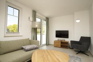 Khu vực ghế ngồi tại Rex Rugia FeWo15-7 mit Schwimmbad und Saunanutzung im AHOI-Erlebnisbad Sellin