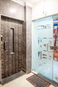 a room with a door with a sign on it at Arkan Egyptian Museum Hotel in Cairo
