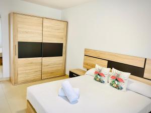 Łóżko lub łóżka w pokoju w obiekcie As Apartamentos Turisticos