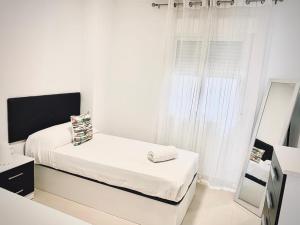 Łóżko lub łóżka w pokoju w obiekcie As Apartamentos Turisticos