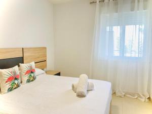 Łóżko lub łóżka w pokoju w obiekcie As Apartamentos Turisticos