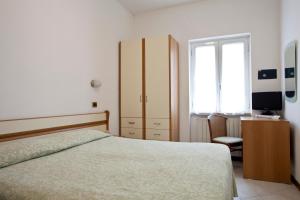 Postel nebo postele na pokoji v ubytování Hotel I 4 Assi