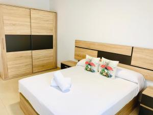 Łóżko lub łóżka w pokoju w obiekcie As Apartamentos Turisticos