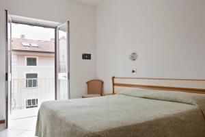 Postel nebo postele na pokoji v ubytování Hotel I 4 Assi