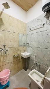 a bathroom with a sink and a toilet at Hotel Pushkar Town in Pushkar