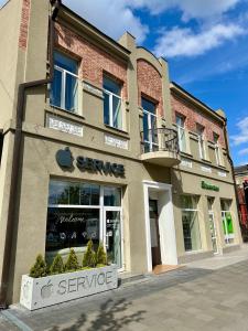 an apple store on the side of a building at Apartments with a coffee machine in the city center, near the theater and Zlata Plaza in Rivne
