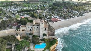 an aerial view of a castle on the beach at Tamarit Beach Resort in Tamarit