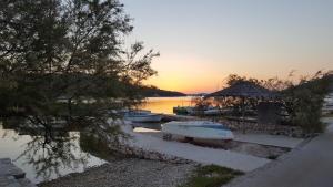 a group of boats parked next to a dock at Insel Kaprije Nowak in Kaprije