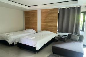 Voodi või voodid majutusasutuse BKL Pool Villa Pattaya toas