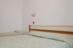 Postel nebo postele na pokoji v ubytování Hotel I 4 Assi