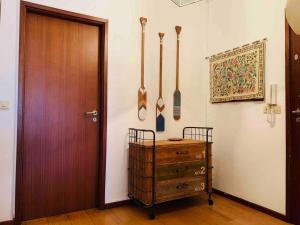 a room with a door and utensils on the wall at Póvoa TOP - Beachfront in Póvoa de Varzim