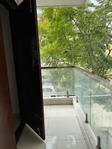 a door to a balcony with a view of a car at Room availbale in 2 bhk apartment in Bengaluru
