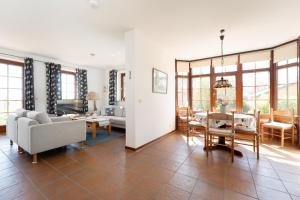 a living room with a couch and a table at Ferienhaus May App 1 in Sahrensdorf