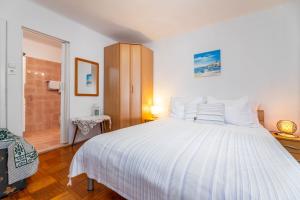 Postel nebo postele na pokoji v ubytování Apartments Katarina