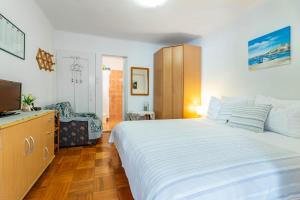 Postel nebo postele na pokoji v ubytování Apartments Katarina