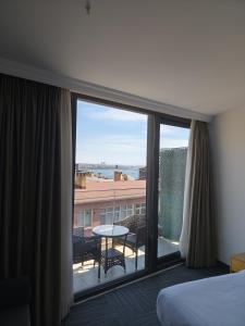 Postel nebo postele na pokoji v ubytování Taksim Hotel V Plus