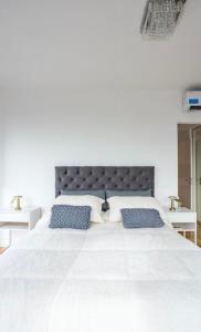 Giường trong phòng chung tại Exclusivo Apartamento con pileta, jacuzzi, gym y vista
