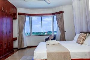 Ένα ή περισσότερα κρεβάτια σε δωμάτιο στο Zuri Holiday Apartments +55 φωτογραφίες