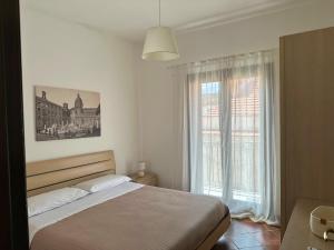 Posteľ alebo postele v izbe v ubytovaní Appartamenti-Residence Al Massimo