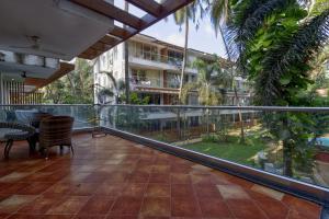 a balcony with a view of a building at Eternal wave by HappyInch in Calangute