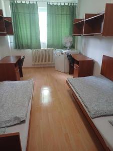 Posteľ alebo postele v izbe v ubytovaní Óbudai Diákszálló