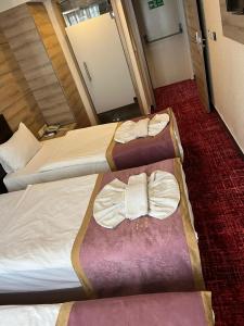 Postel nebo postele na pokoji v ubytování Nida Hotel Cıty Center