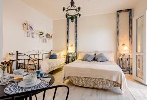 Postel nebo postele na pokoji v ubytování Casa Daflanna in Salento - Libeccio (monolocale)