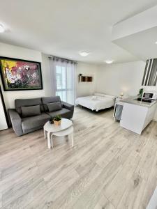 a living room with a couch and a table at Apartamentos Rincón del Mar in Torre del Mar