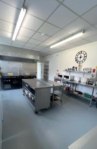 a large kitchen with a table in a room at The Beeches - Entire Mansion in Bristol +10 photos