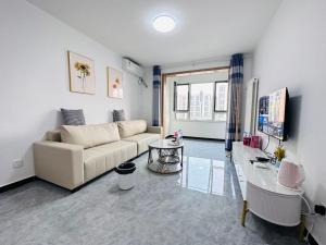 a living room with a couch and a table at Little Room in Ruakura Junction
