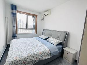 a bedroom with a bed and a window at Little Room in Ruakura Junction