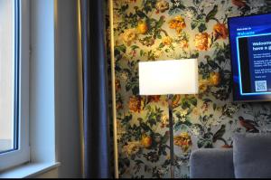Sjónvarps- og/eða afþreyingartæki á Home Hotel Norre Park