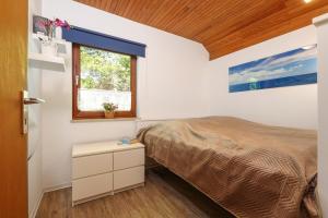 Postel nebo postele na pokoji v ubytování Strandmuschel