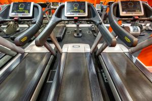 a row of escalators in a gym at Crowne Plaza London Ealing by IHG in London