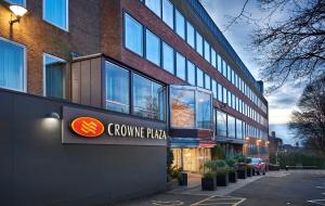 a building with a crocus pizza sign in front of it at Crowne Plaza London Ealing by IHG in London